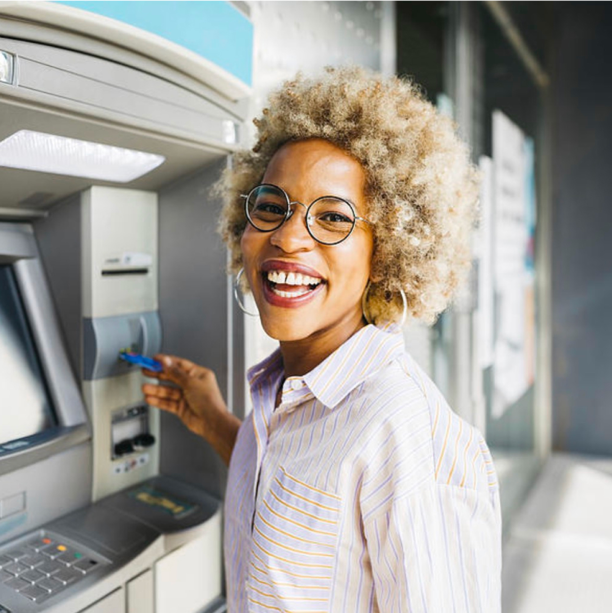 woman-using-atm-machine